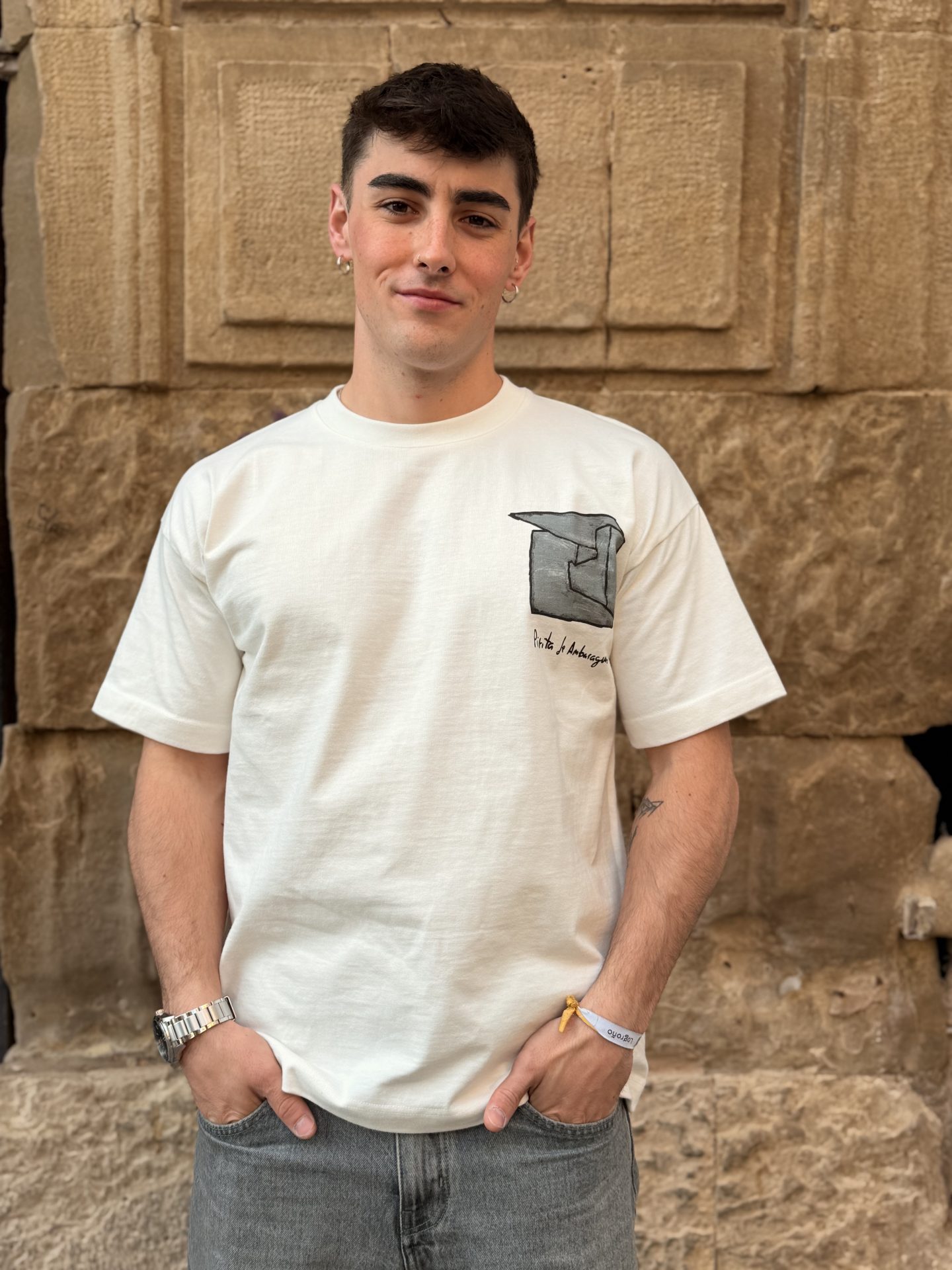 piryte-tshirt-white-heavy-cotton-bynds.jpeg Man wearing the white PIRYTE T-shirt with black graphic text on the front and sleeve, made of 100% heavy jersey cotton in a relaxed fit.